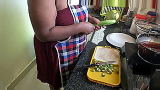 mom and dad enjoy in kitchen